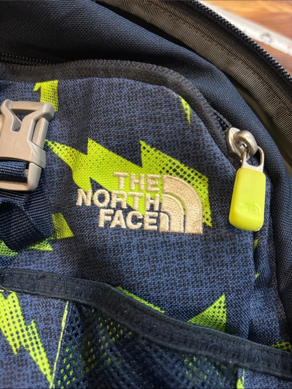 The North Face Black Backpack with Neon Green Lightning Print